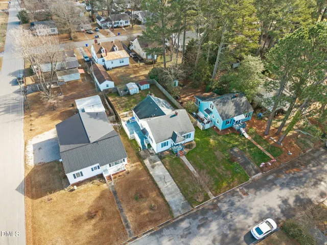 an aerial view of residential houses with outdoor space