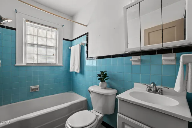 a bathroom with a sink toilet and bathtub