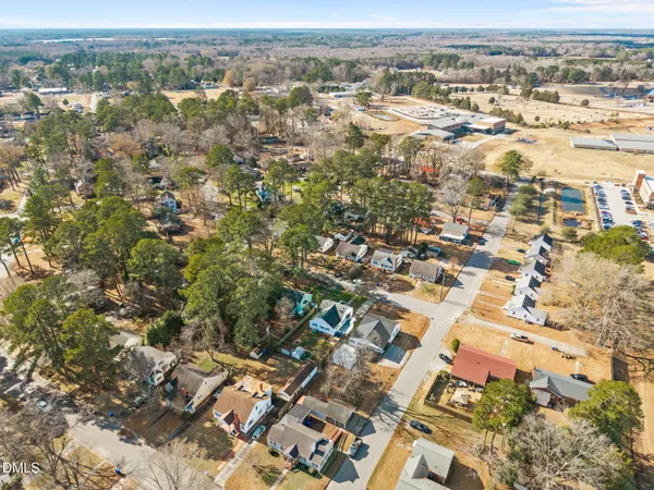 an aerial view of residential houses with city view