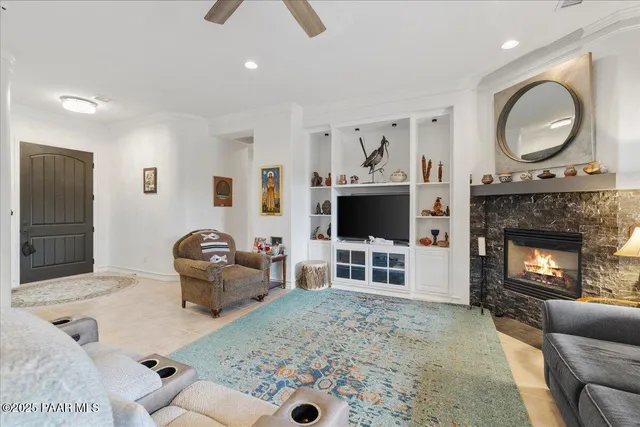 a room with fireplace furniture and a view of living room