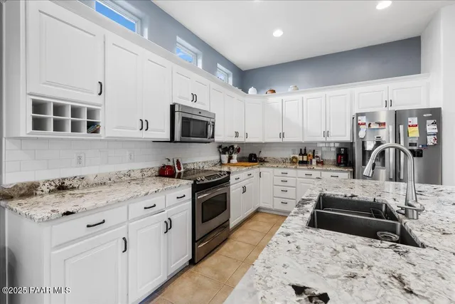 a room that has a bed and a mirror in it