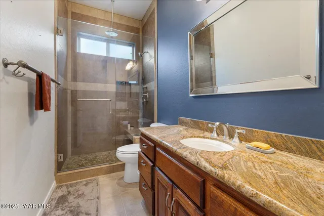 a work room with furniture and a window