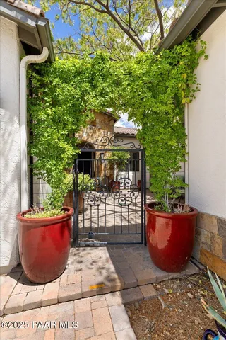 a view of a backyard with sitting area