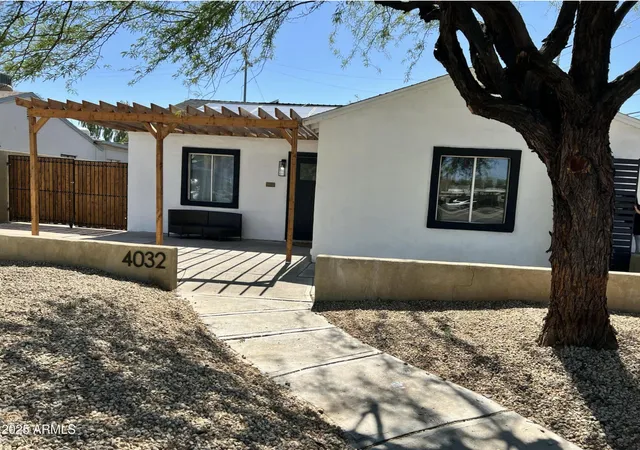 a view of a house with a snow in the yard