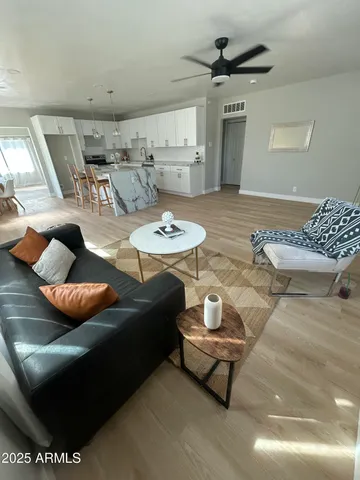 a living room with furniture and a rug