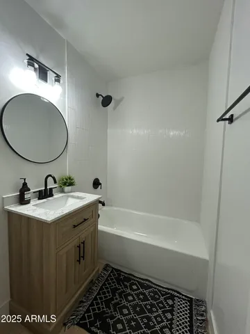 a view of a livingroom with a ceiling fan and window