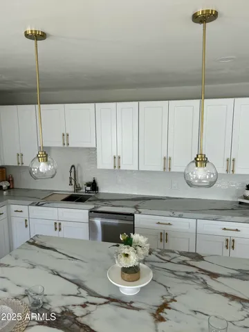 a kitchen with a sink and cabinets