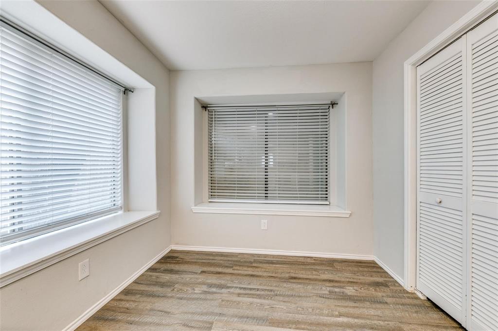 701 Kipling Drive Plano, TX 75023 - Photo 12 of 24 a view of an empty room with wooden floor and a window