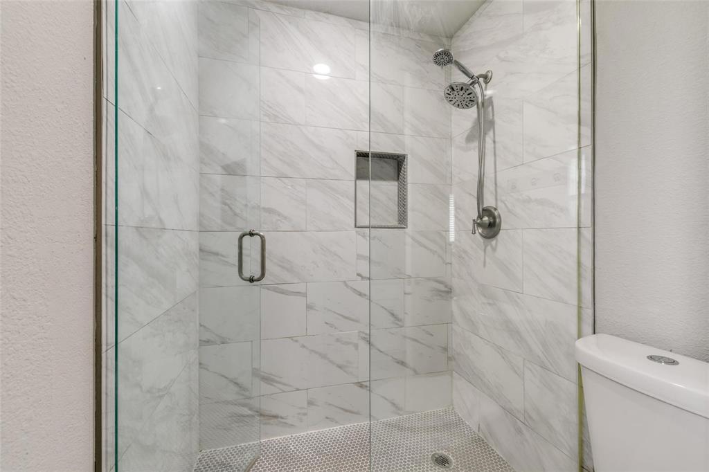 701 Kipling Drive Plano, TX 75023 - Photo 19 of 24 a bathroom with a shower