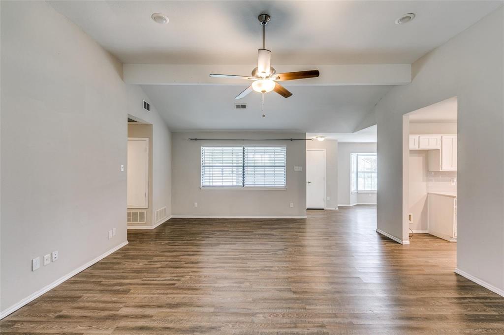 701 Kipling Drive Plano, TX 75023 - Photo 8 of 24 a view of an empty room with window and wooden floor