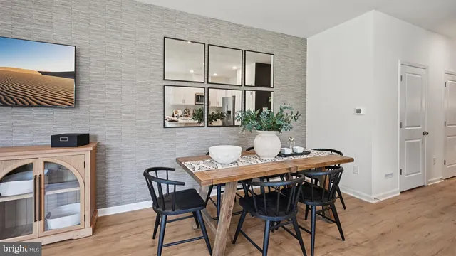 a view of a dining room with furniture and window