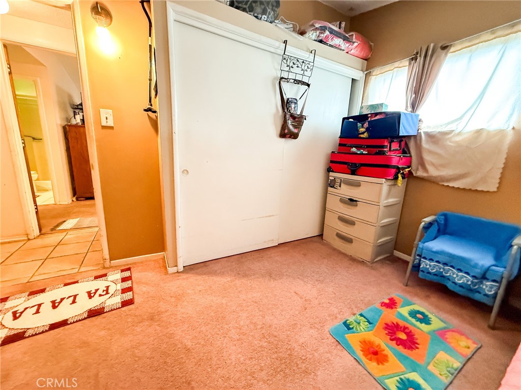 6712 La Jolla Drive Riverside, CA 92504 - Photo 16 of 29 a bedroom with toys and a bed