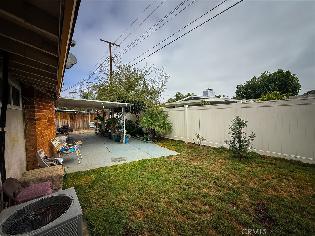6712 La Jolla Drive Riverside, CA 92504 - Photo 23 of 29 a view of a backyard with hardwood area and lake view