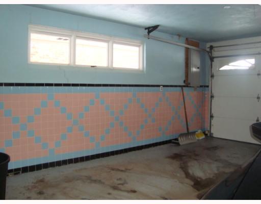 604 Harrison City Road Trafford, PA 15085 - Photo 14 of 18 Parking Lot/Garage. Large Light Bright 2 Car Attached to Kitchen with Mandoor to Back Yard / Plaster / Custome Ceramic Tile Surround / Epoxy Floor