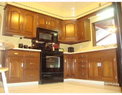 604 Harrison City Road Trafford, PA 15085 - Photo 5 of 18 Kitchen. Exquisite Teek Wood and FULL Custom Ceramic Walls, Ceiling and Flooring<BR/>Corian Bar Open to Great Room room