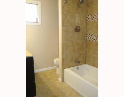 604 Harrison City Road Trafford, PA 15085 - Photo 8 of 18 Exterior Front. Custom Ceramic Full Surround Bath. Easy cleaning, Bright and Gleaming.