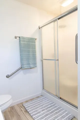 a view of a wooden deck with a bench