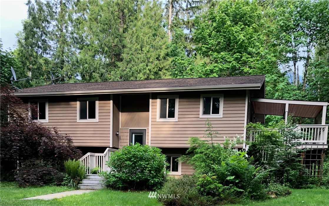 6341 Rutsatz Road Deming, WA 98244 - Photo 1 of 1 a front view of house with yard and green space
