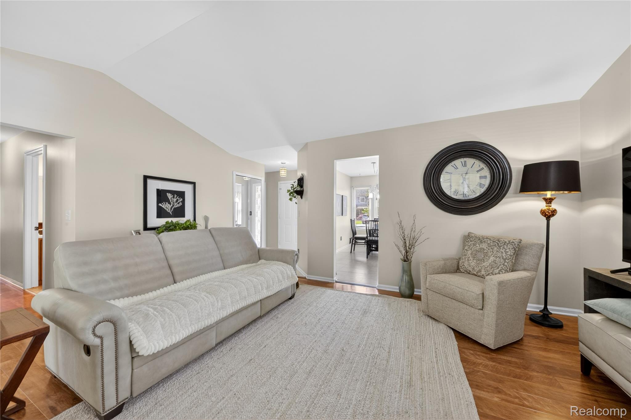 44570 Ridgefield Road Canton, MI 48188 - Photo 11 of 31 Vaulted ceiling living area with wood-finish flooring, a neutral color palette, and recessed lighting