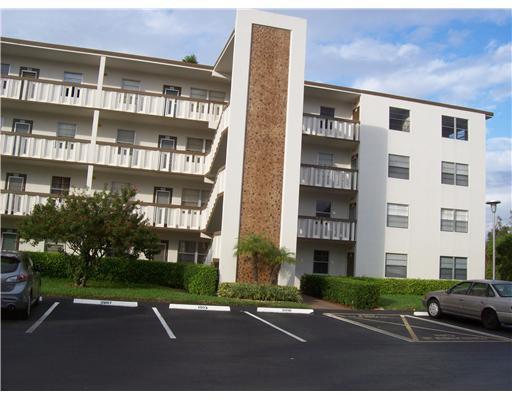 4002 Hythe A, Unit 4002 Boca Raton, FL 33434 - Photo 2 of 10 a view of a building with a street