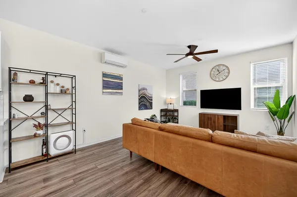 a living room with furniture and a window