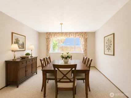a dining room with furniture and window