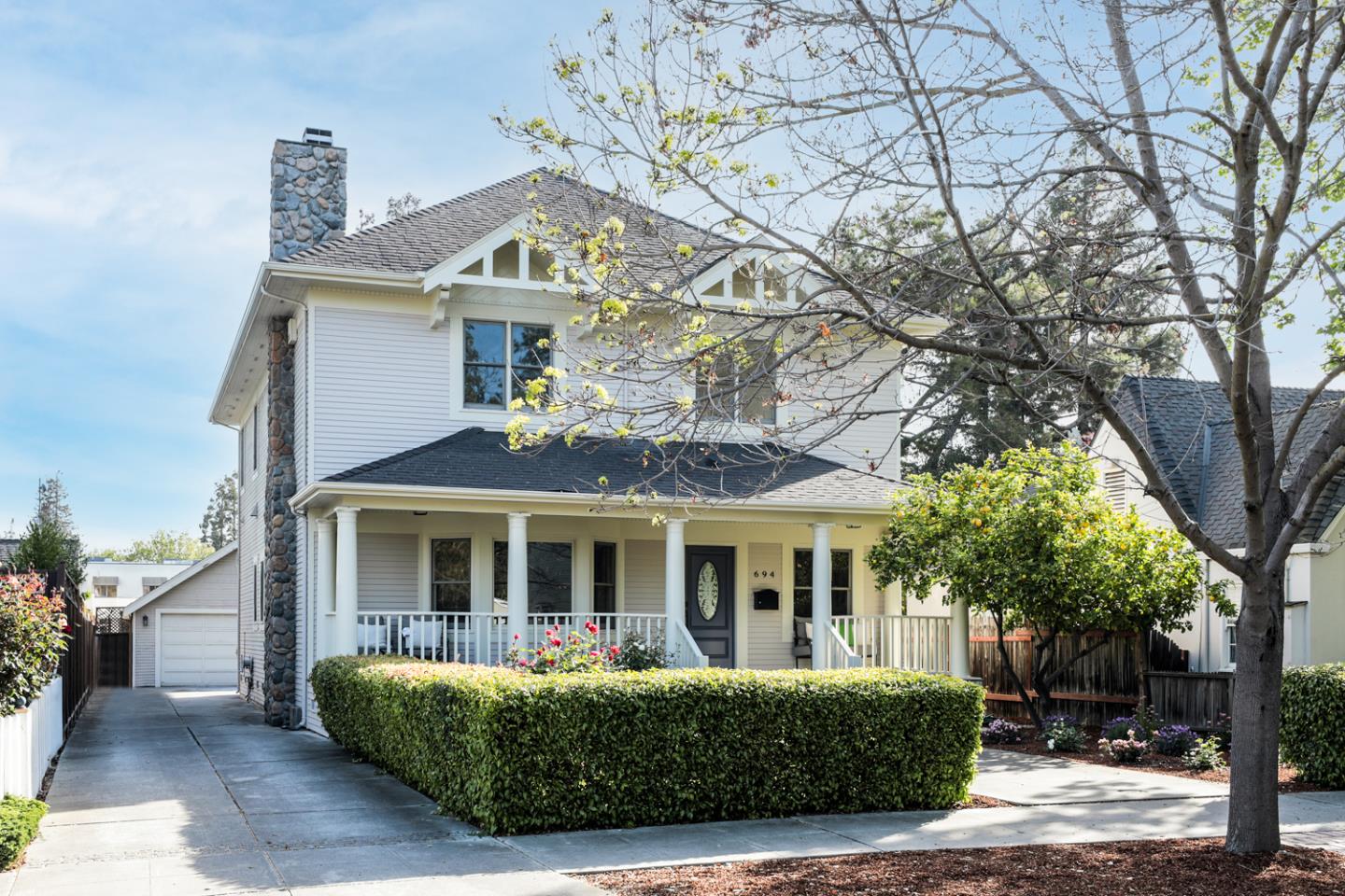 a front view of a house with garden