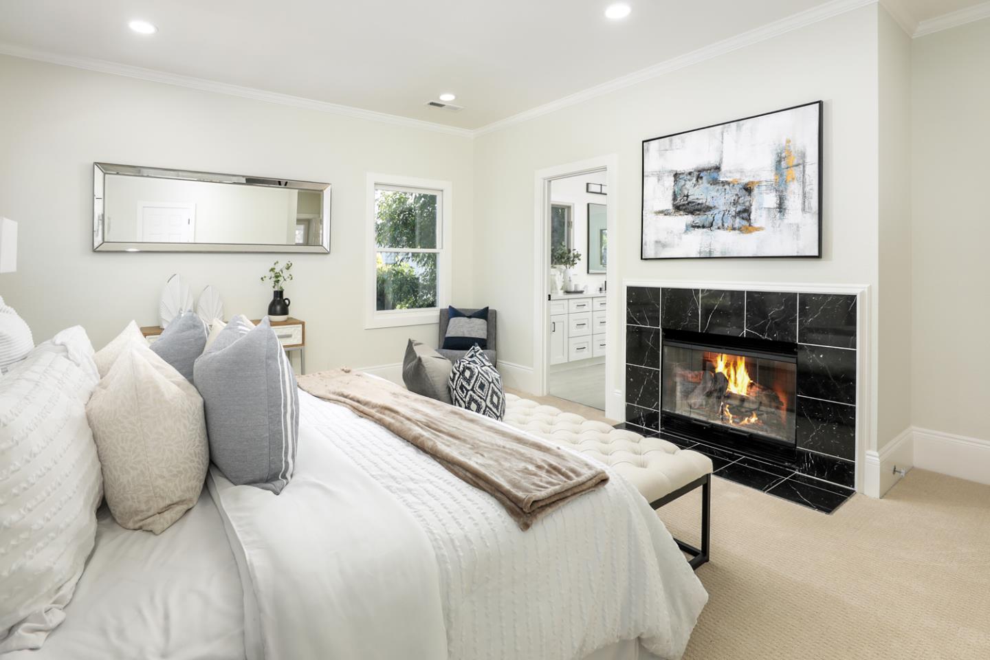 694 Morse Street San Jose, CA 95126 - Photo 17 of 38 a bedroom with a bed and a fireplace