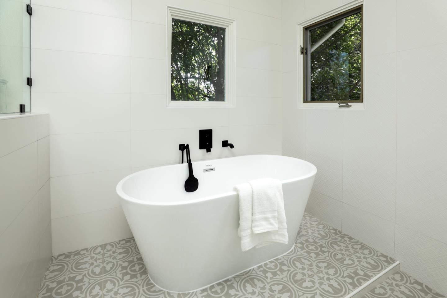 694 Morse Street San Jose, CA 95126 - Photo 20 of 38 a white bath tub sitting in a bathroom