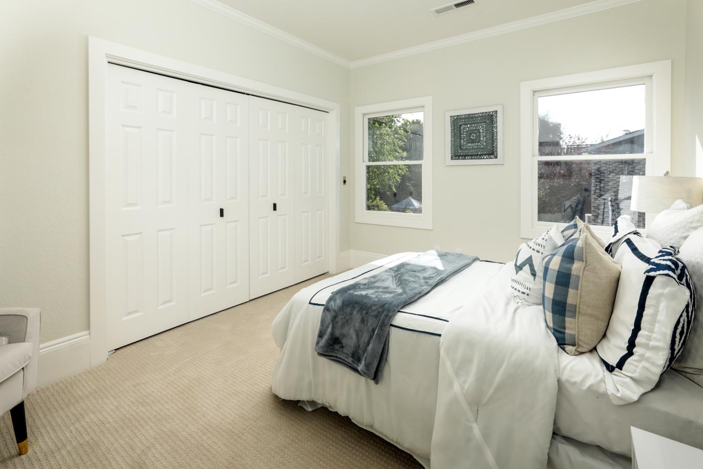694 Morse Street San Jose, CA 95126 - Photo 28 of 38 a bedroom with a bed a window and potted plant