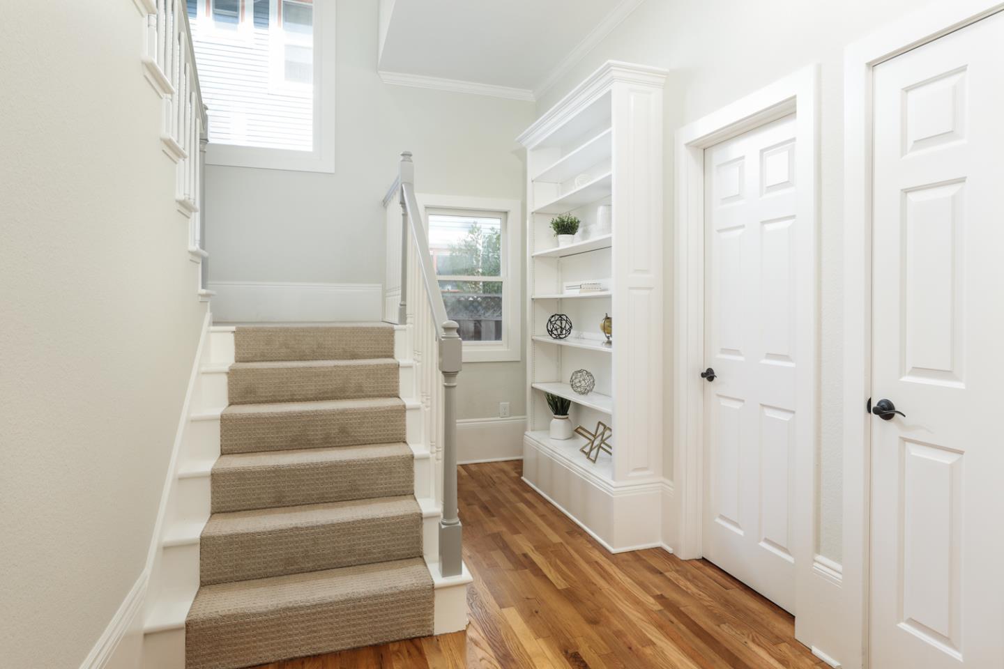 694 Morse Street San Jose, CA 95126 - Photo 29 of 38 a view of a hallway with wooden floor and entryway