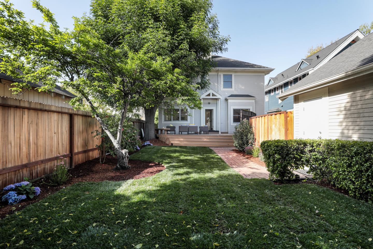 694 Morse Street San Jose, CA 95126 - Photo 33 of 38 a view of a yard in front of a house with a large tree