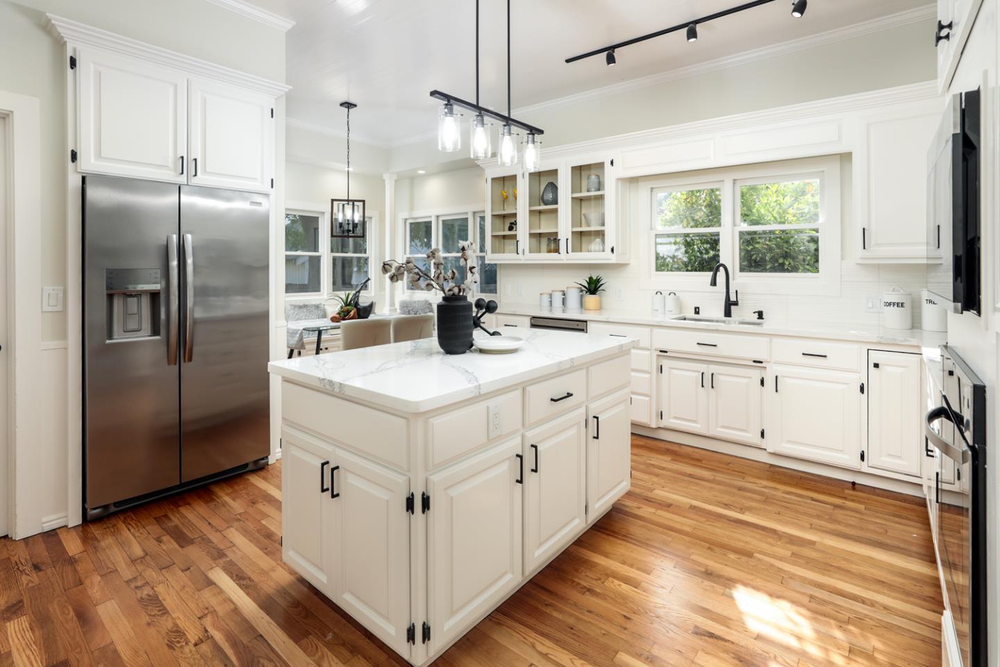 694 Morse Street San Jose, CA 95126 - Photo 8 of 38 a kitchen with stainless steel appliances cabinets a sink and a window