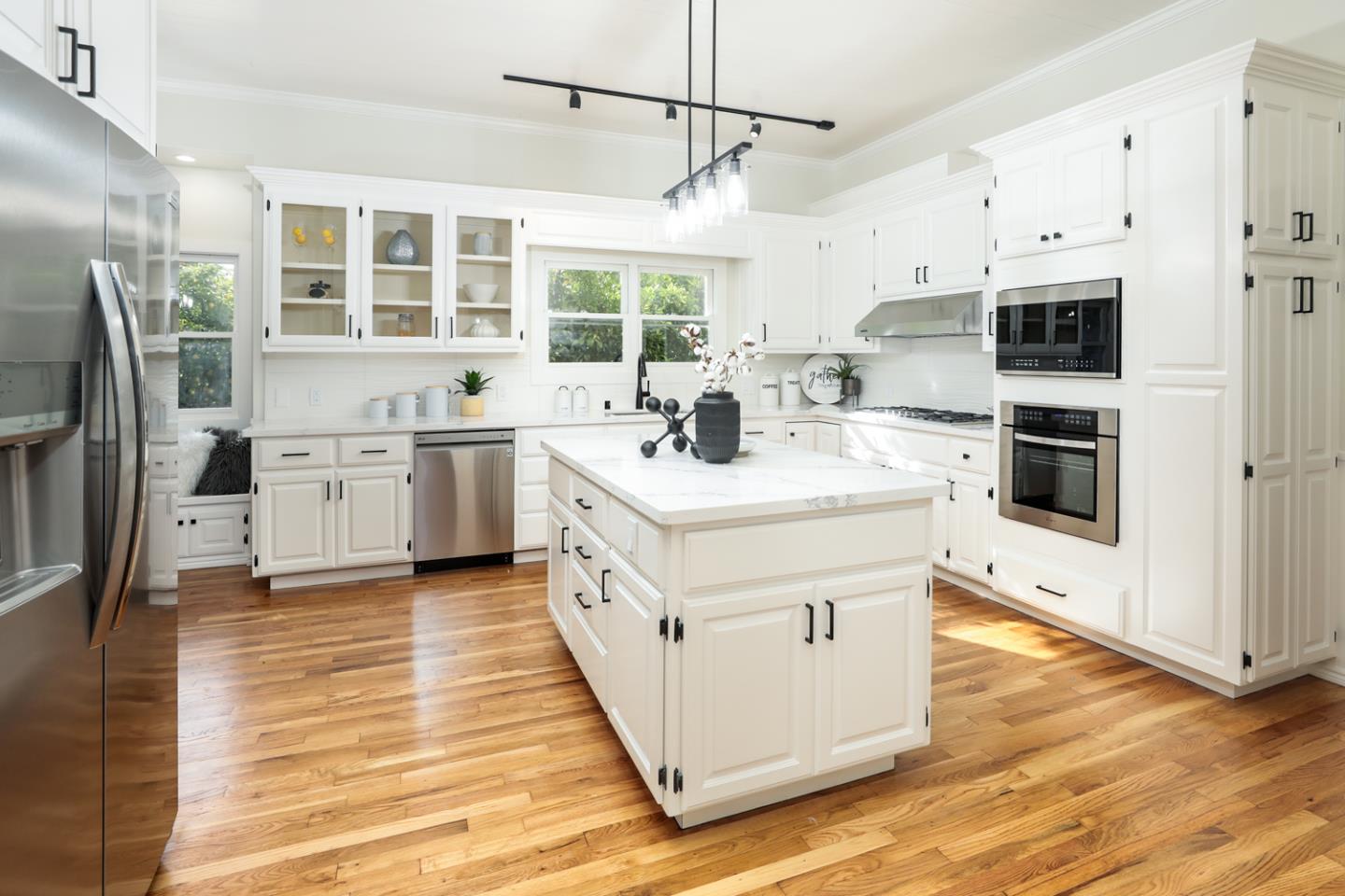 694 Morse Street San Jose, CA 95126 - Photo 9 of 38 a kitchen with stainless steel appliances granite countertop a sink stove and refrigerator