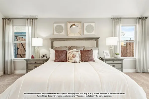 a large white bed in a white room