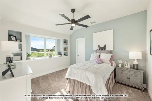a bedroom with a bed and a large window