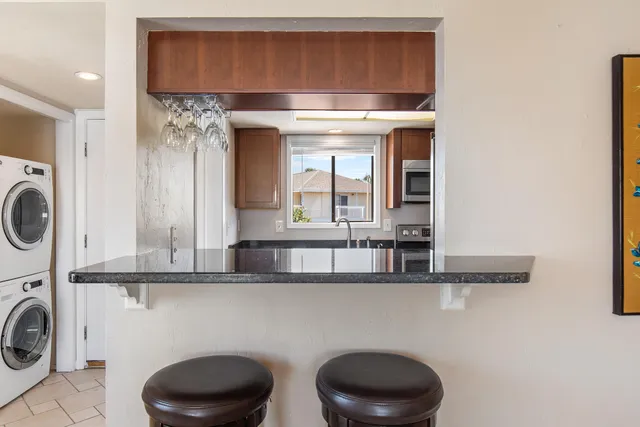 a kitchen with a cabinets and a stove top oven