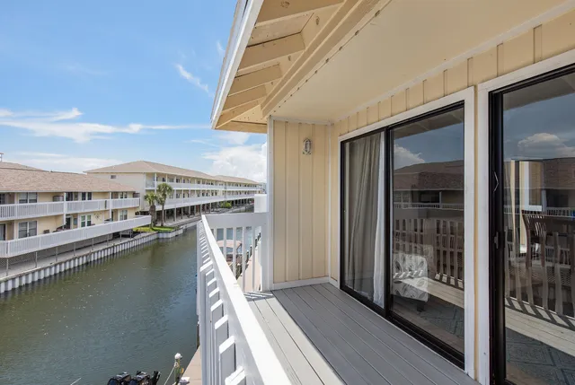 a view of a balcony with an ocean view