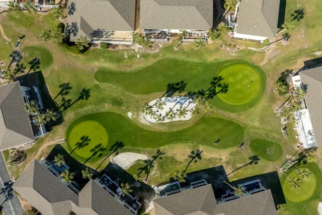 an aerial view of a house with a swimming pool