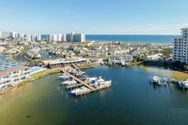 a view of a ocean with boats and trees in ocean