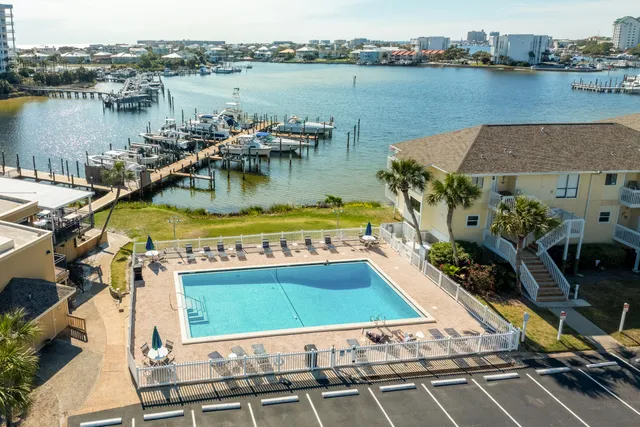 a view of a lake with a table and chairs