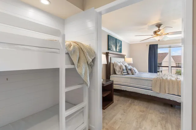 a bedroom with furniture and a chandelier