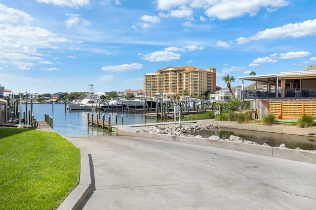 a view of a lake with boats and trees
