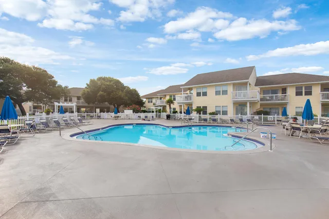 a view of a house with swimming pool