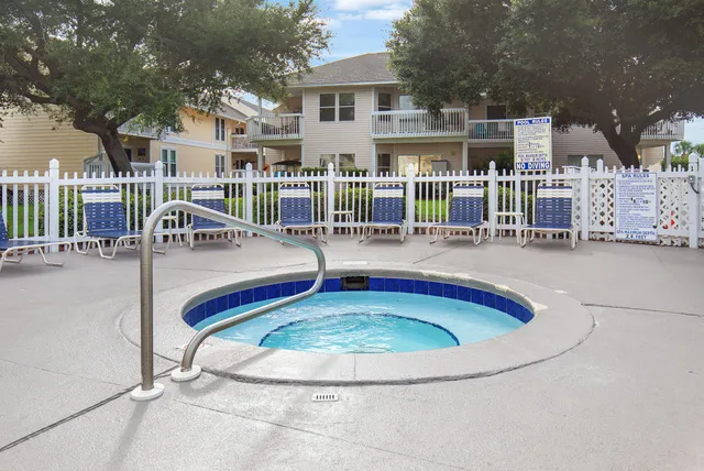 a view of swimming pool with sitting space