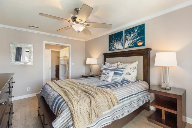 a bedroom with a bed and a chandelier