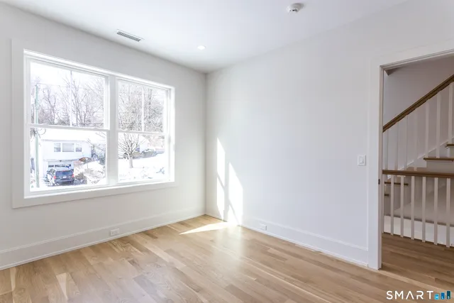 a view of an empty room and window