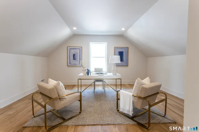 a living room with furniture and a table