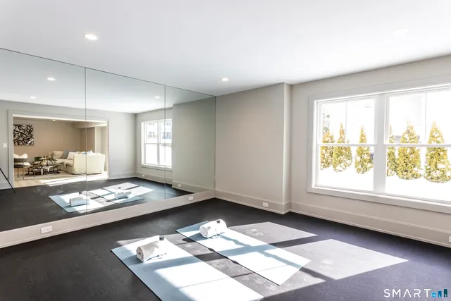 a bathroom with a sink toilet a mirror and shower