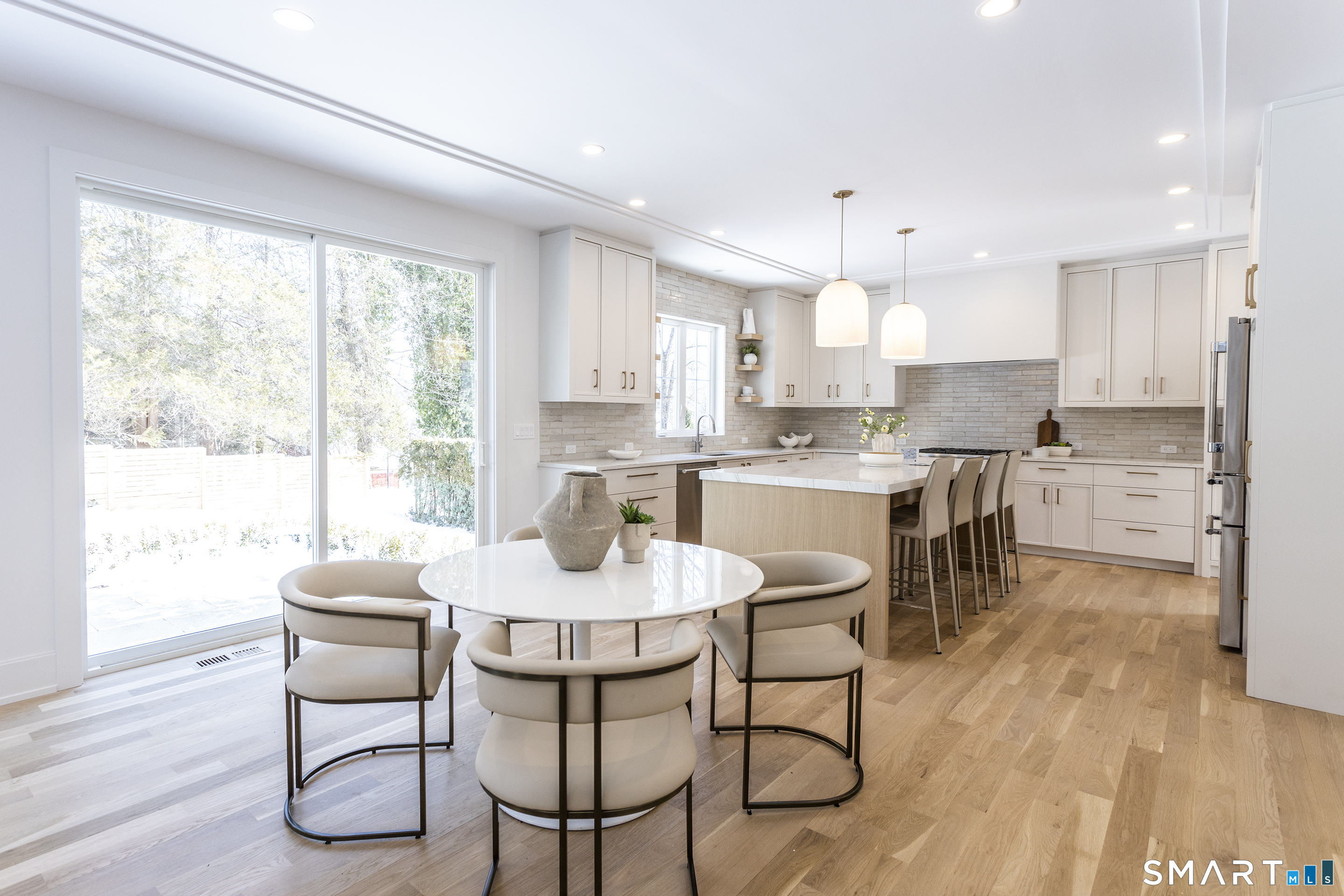 10 Wakenor Road Westport, CT 06880 - Photo 9 of 34 Kitchen opens up to breakfast & family room with sliding doors to granite patio